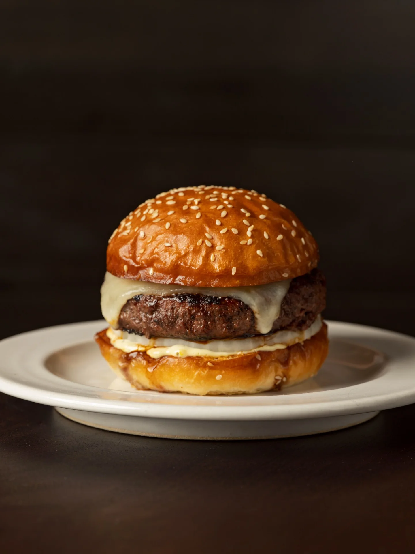 The dry-aged steak burger on a sesame bun