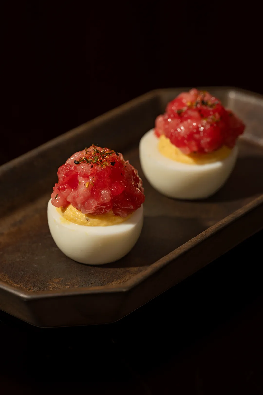 Deviled eggs topped with tuna tartare