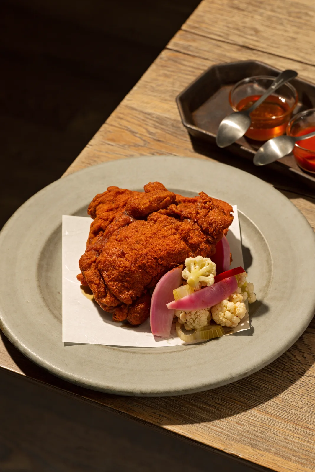 Fried chicken with pickled cauliflower and watermelon radish