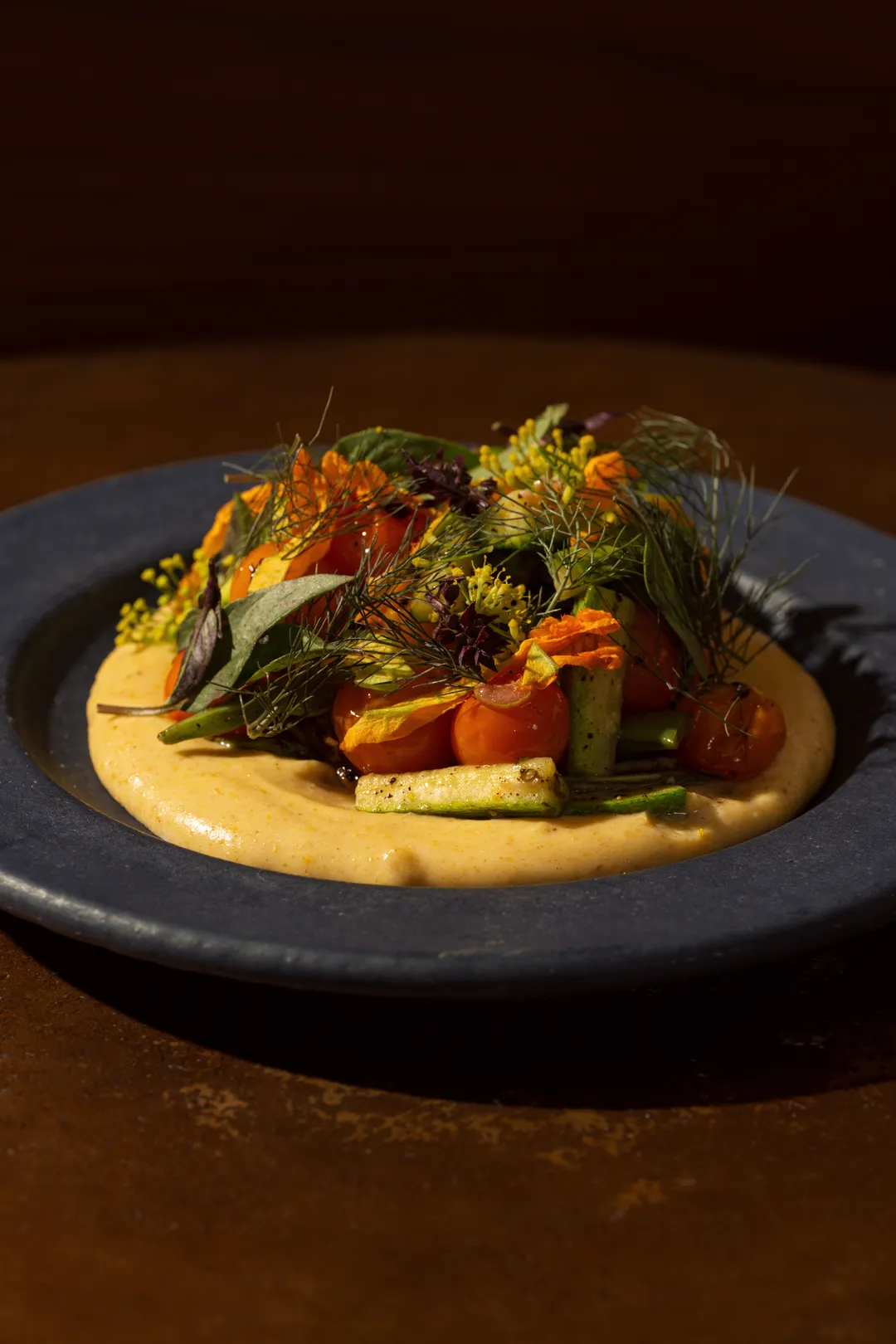 Blistered tomatoes and squash over a saffron cream with garden herbs