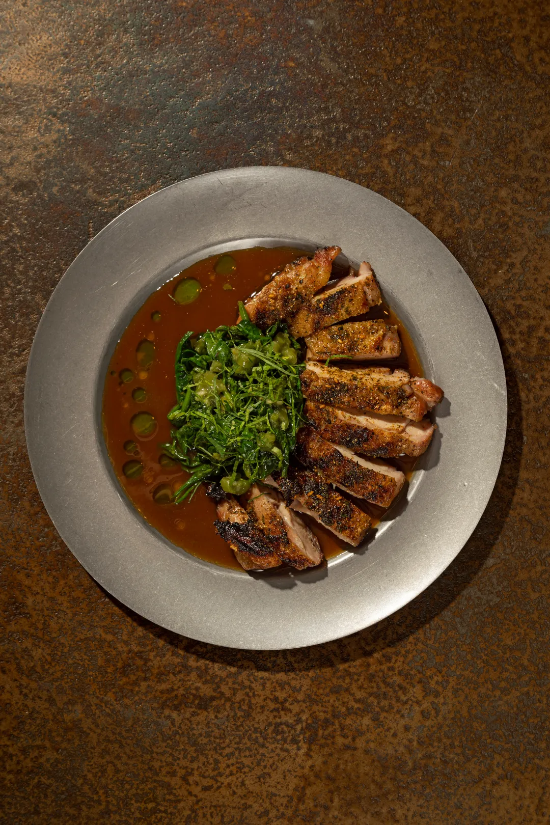 Spice-crusted grilled chicken with salsa verde and jus
