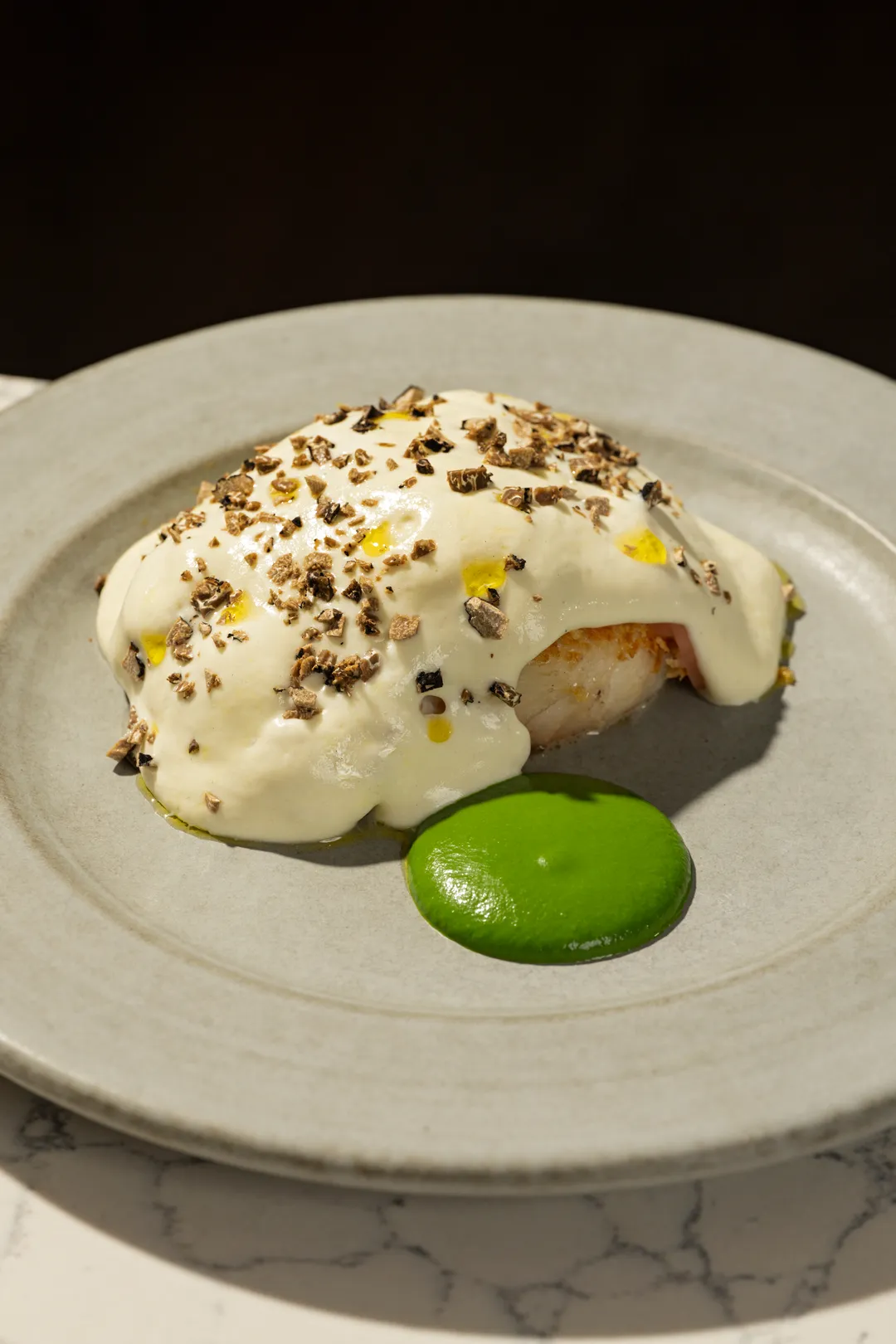 Grilled Pacific cod with Weiser potato, black truffle, and tarragon