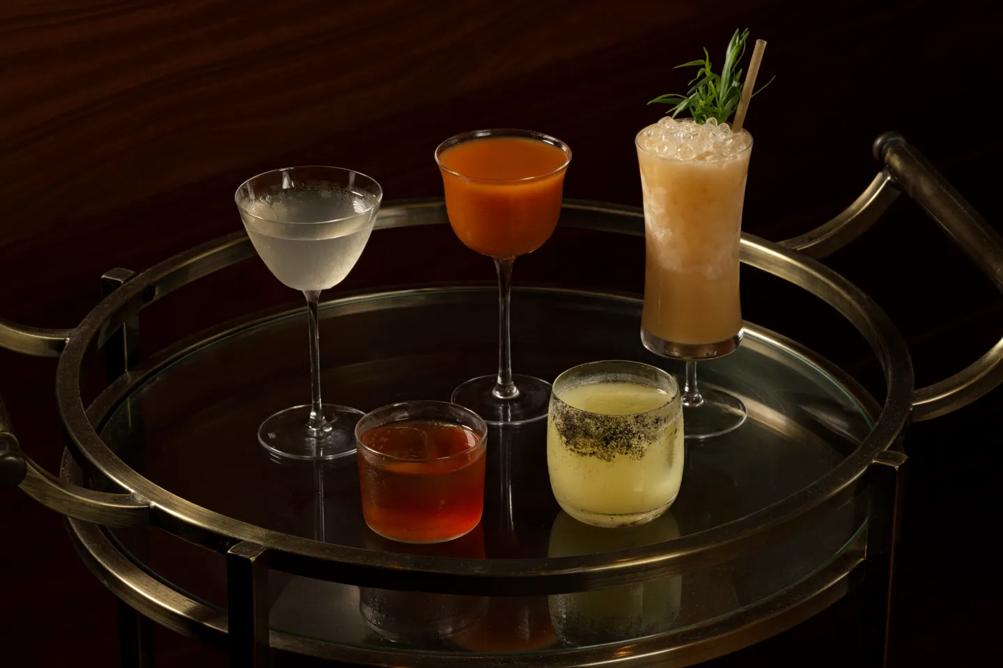 Cocktails on a brass bar cart at Darling
