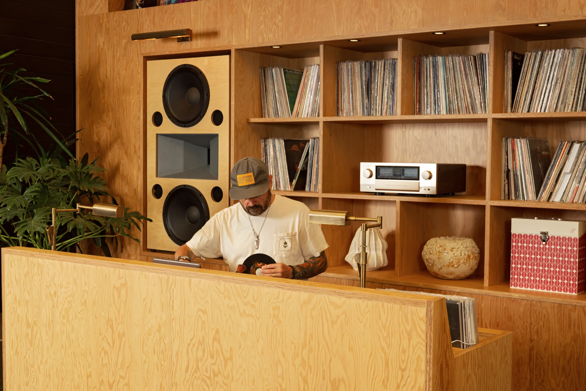 The DJ booth at Darling, pulling records beside the plywood speaker wall