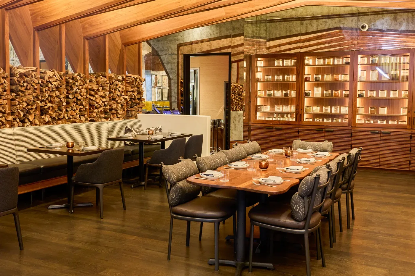 The private dining room at Darling, vaulted timber ceiling over a long set table