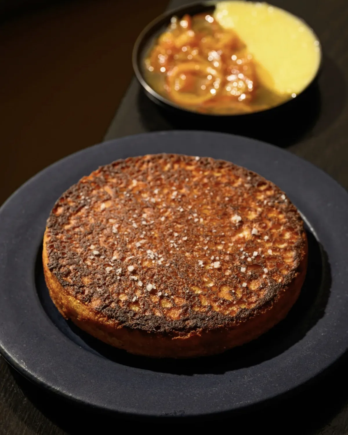 Skillet cornbread with a salted crust, cultured butter, and preserves